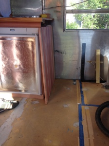 Fridge of left; to be built bed/cabinet on right. Needed a cabinet that fits in the middle. 